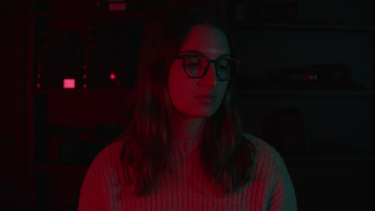 Portrait lit strongly red from one side