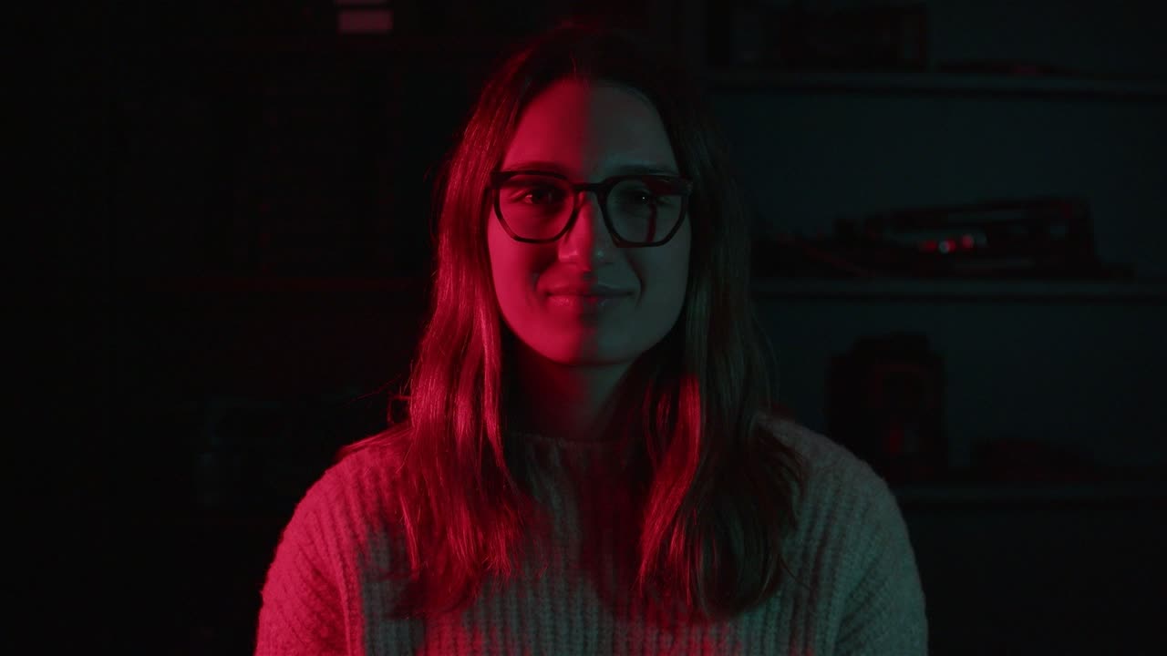 Laughing portrait in red and teal light